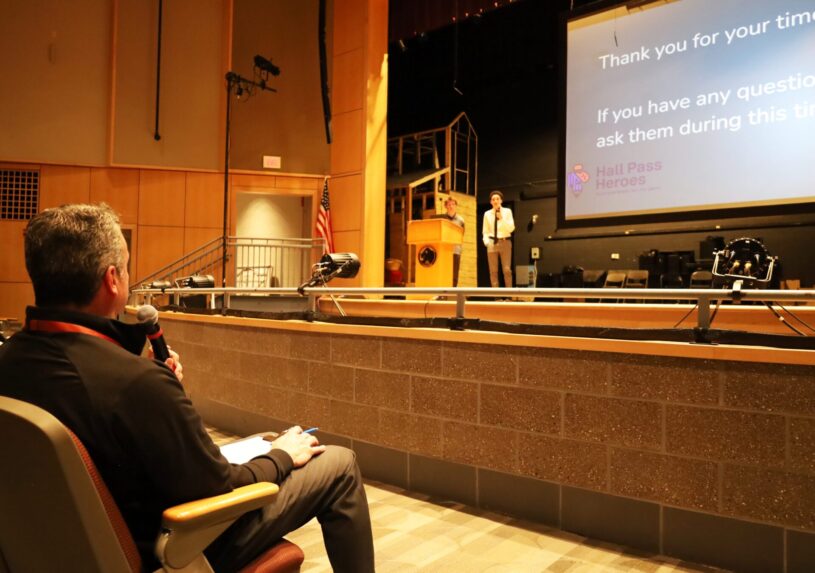 Serving as a judge during the Nov. 7 entrepreneurial competition at Chelmsford High School, Principal Stephen Murray asks a question of the Hall Pass Heroes group, which includes junior Chris Kurbs, freshman Theo Frias and sophomore Cameron Panzeri.