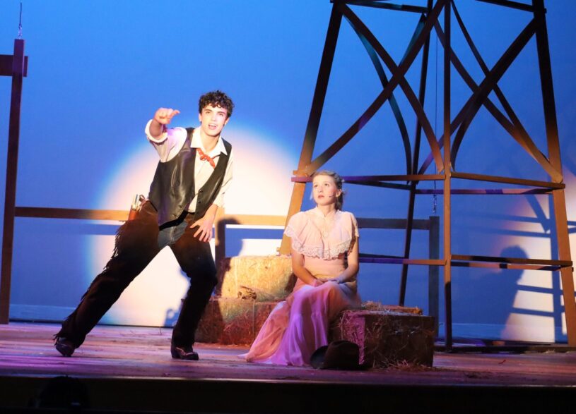 Alex Kurth as Curly McLain and Lily Rogers as Laurey Williams perform a scene during dress rehearsal for the Chelmsford High Theatre Guild's production of "Oklahoma!"