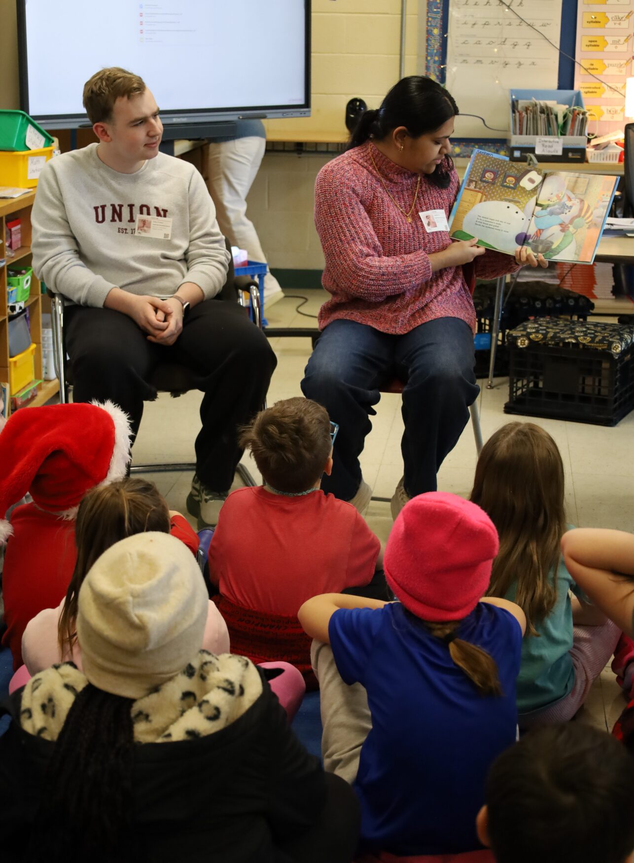 IMG_8841 Chelmsford High School National English Honor Society members Josh Wolman and Samhitha Shreesha Pai read to students in Mrs. Stagnone's third grade class at South Row Elementary School.