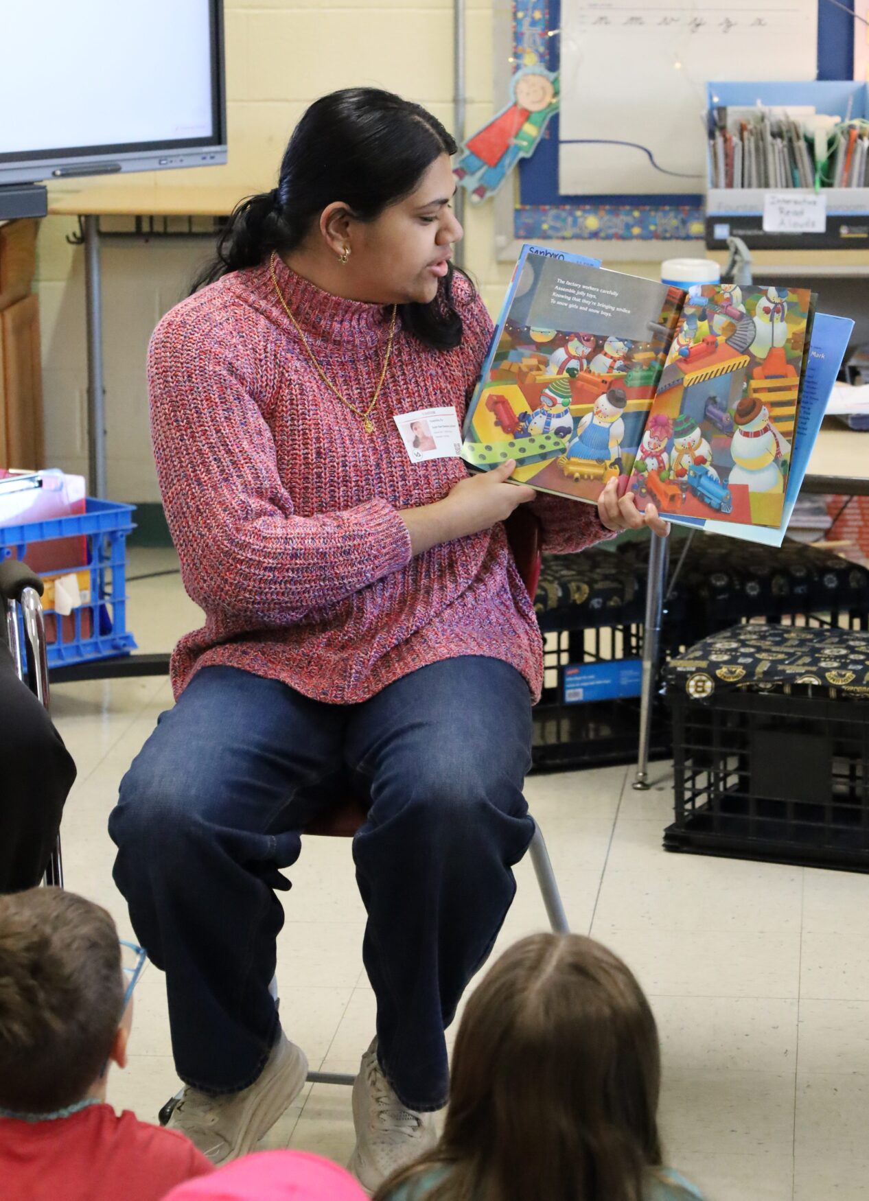 IMG_8845 Chelmsford High School National English Honor Society member Samhitha Shreesha Pai reads to students in Mrs. Stagnone's third grade class at South Row Elementary School.