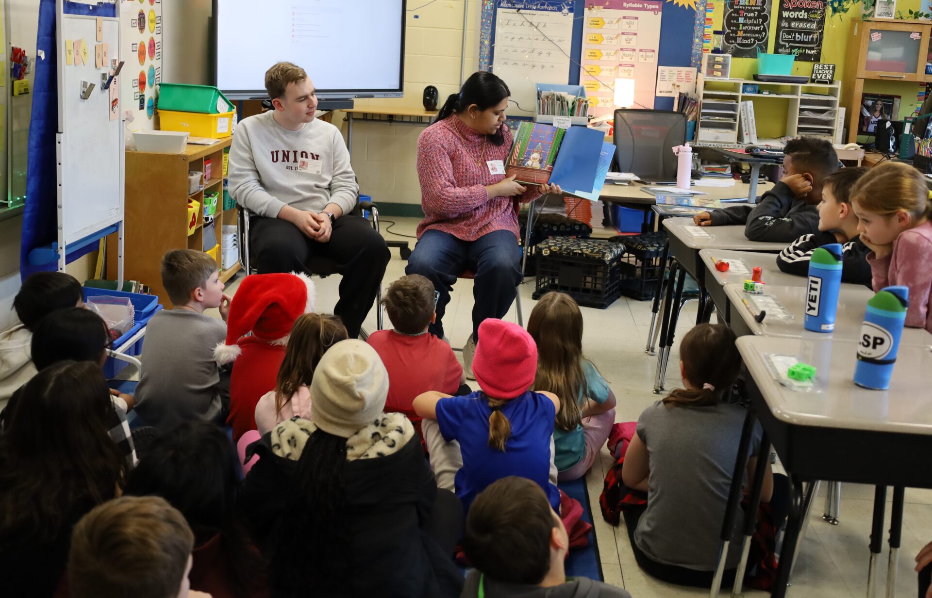 IMG_8846 Chelmsford High School National English Honor Society members Josh Wolman and Samhitha Shreesha Pai read to students in Mrs. Stagnone's third grade class at South Row Elementary School.