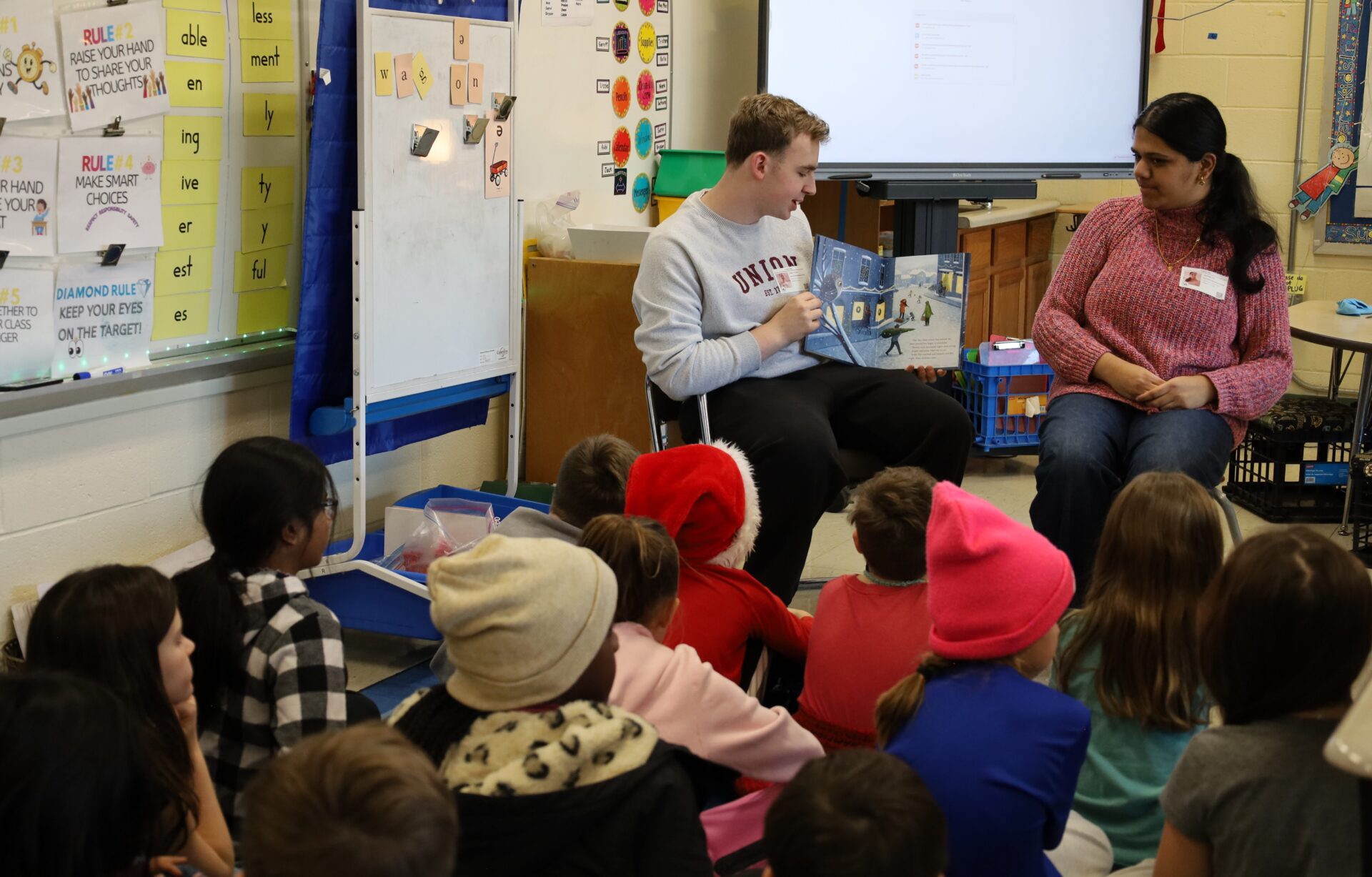 IMG_8849 Chelmsford High School National English Honor Society members Josh Wolman and Samhitha Shreesha Pai read to students in Mrs. Stagnone's third grade class at South Row Elementary School.
