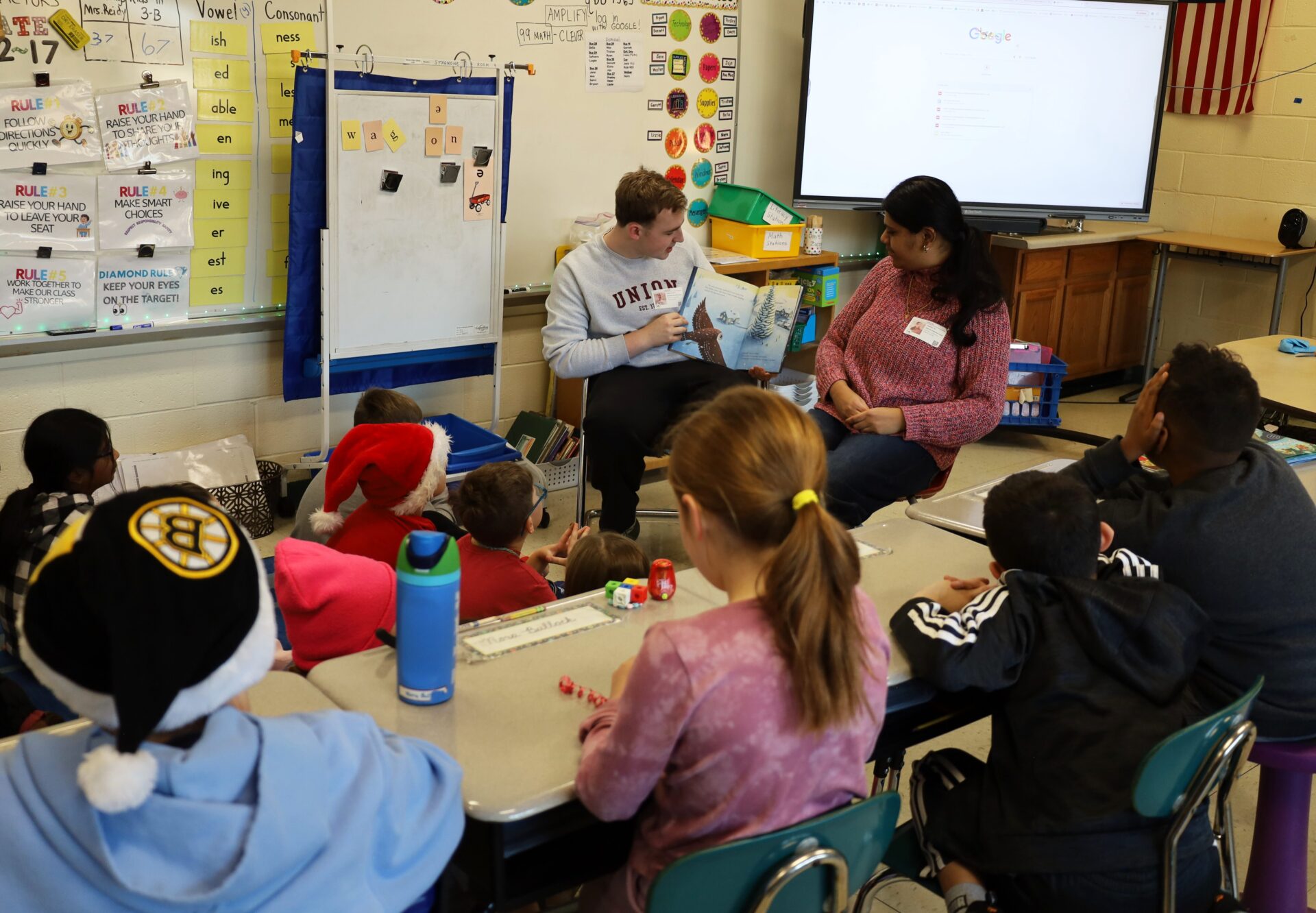 IMG_8851 Chelmsford High School National English Honor Society members Josh Wolman and Samhitha Shreesha Pai read to students in Mrs. Stagnone's third grade class at South Row Elementary School.