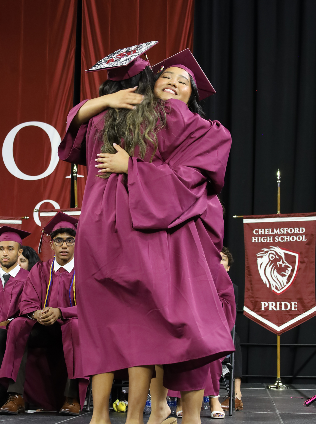 Ava Sak Hug Chelmsford High School's Class of 2026 Secretary Ava Sak hugs one of her classmates during graduation on June 6, 2026.