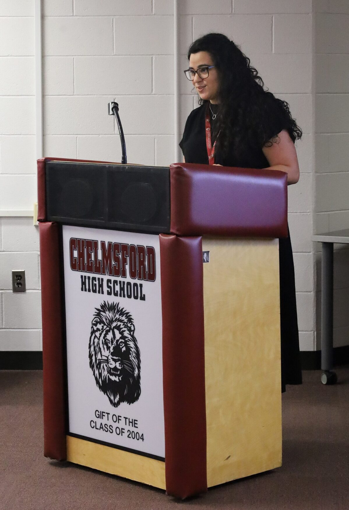 Career & College Readiness Coordinator Gabriella Da Silva welcomes those in attendance for Chelmsford High School's Innovation Pathways Graduation Ceremony on May 28, 2026.