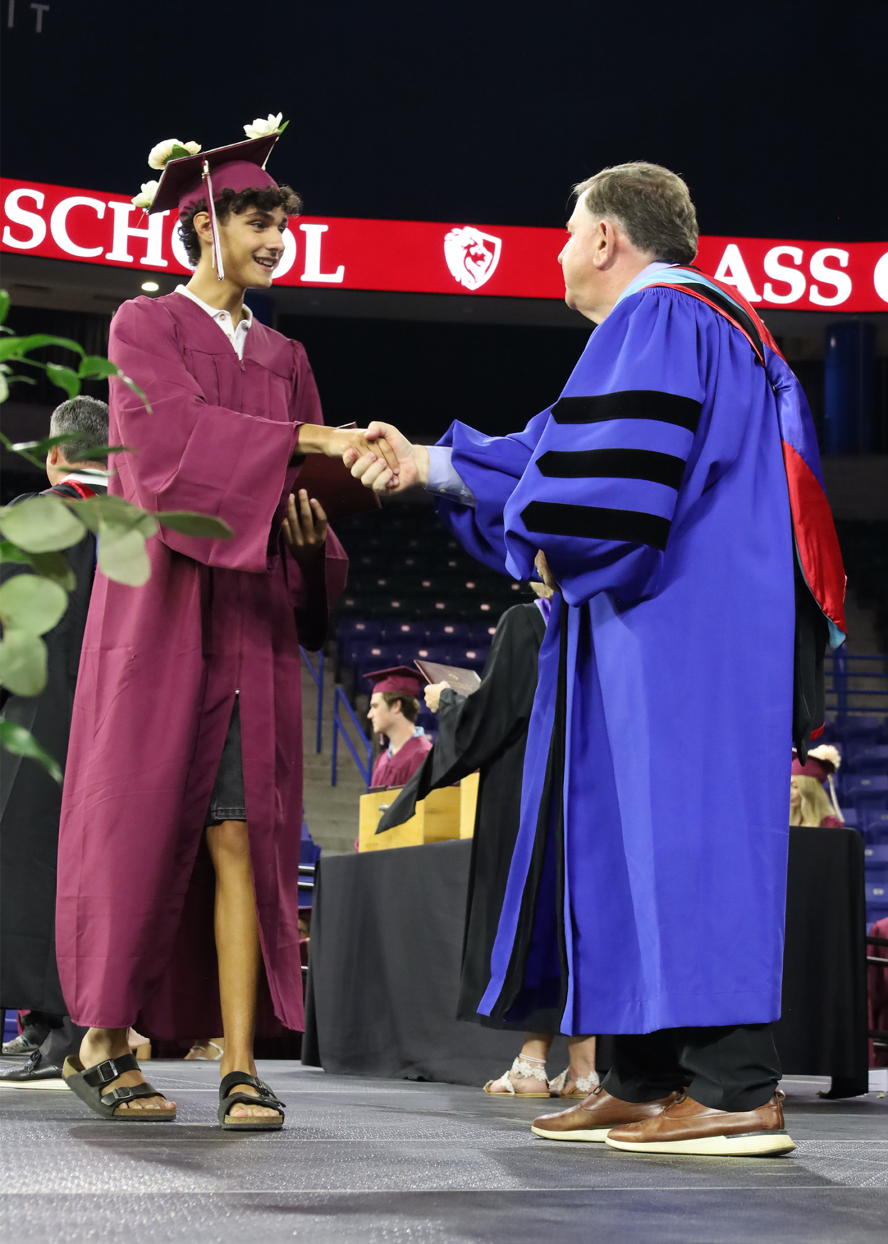 Grad Super Shake Superintendent Dr. Jay Lang shakes the hand of Samuel Toledo during the commencement exercises for Chelmsford High School's Class of 2026 on June 6.