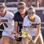 Chelmsford’s Marykate McDonald, front, and Wellesley’s Tara Battaglino battle for a loose ball during Chelmsford’s 7-6 girls lacrosse win on June 3, 2026.