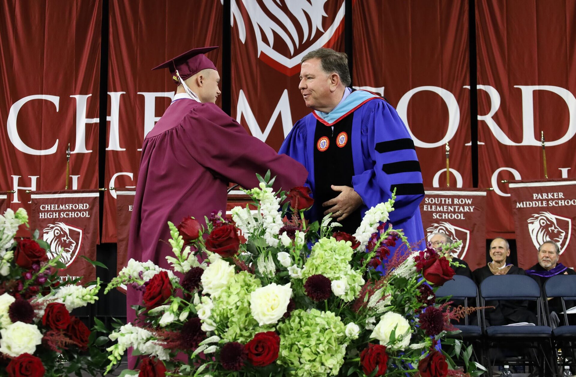 Luke Jay Shake Superintendent Dr. Jay Lang shakes the hand of Lucas Farrell during the commencement exercises for Chelmsford High School's Class of 2026 on June 6.