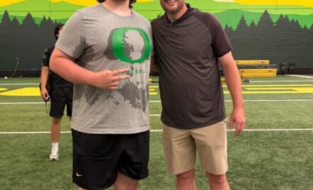 Chelmsford High lineman Brady Mahoney, left, poses with University of Oregon football coach Dan Lanning when Mahoney attended the school’s camp recently. Mahoney will be a junior at Chelmsford in the fall.