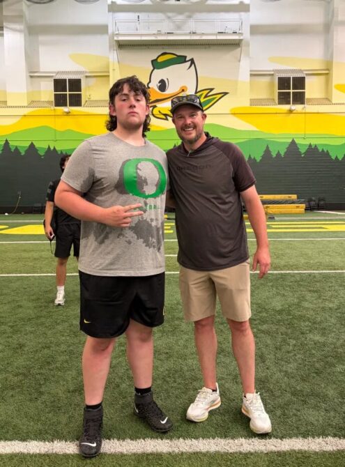 Chelmsford High lineman Brady Mahoney, left, poses with University of Oregon football coach Dan Lanning when Mahoney attended the school’s camp recently. Mahoney will be a junior at Chelmsford in the fall.