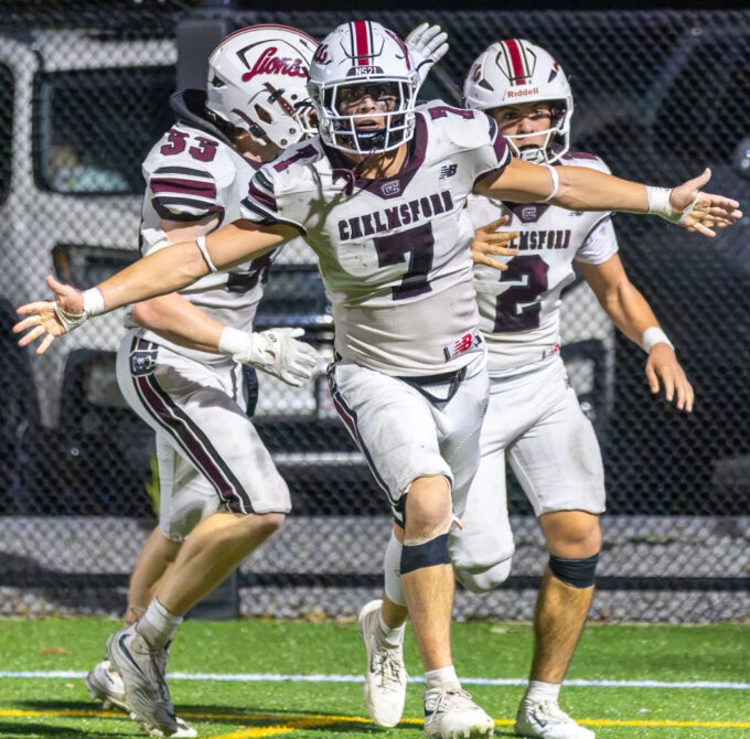Chelmsford’s Skyler DeJesus, right, celebrates his touchdown with Colin Clark and Quinn Stefanini during Friday’s MVC football game against Tewksbury at Doucette Field in Tewksbury. Chelmsford earned a 28-21 win.