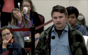 Chelmsford High School Ecology Club member Jeffrey Zekser speaks in favor of the proposed ban on single-use black plastic food containers at local food establishments.